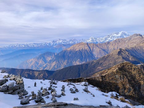 Scenic view of the snow-covered Himalayan mountains from Tungnath, India, showcasing natural beauty.